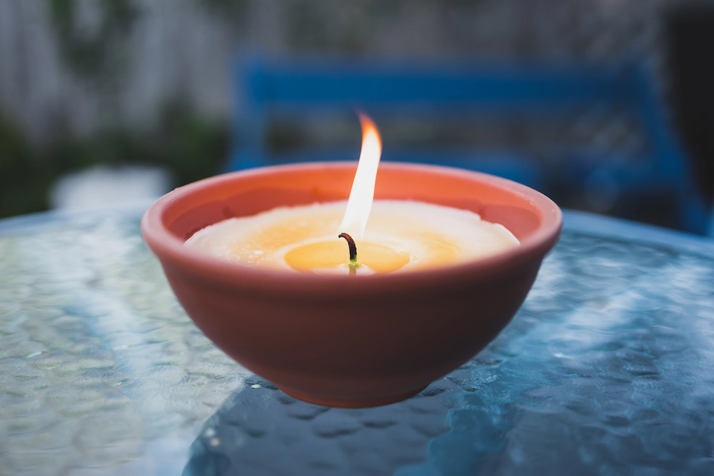 Citronella candle on table