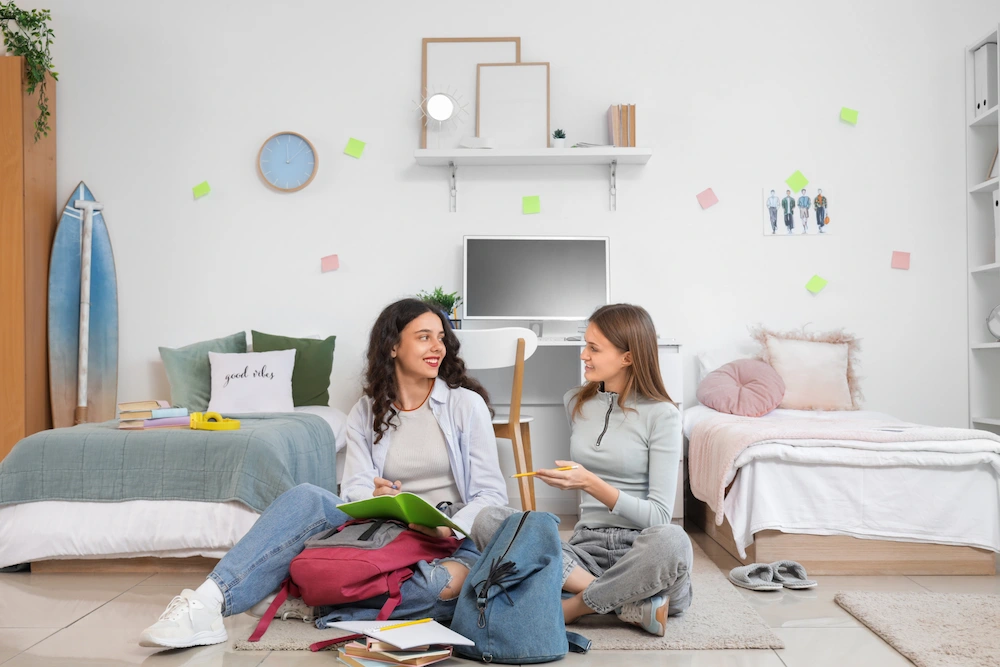 female roommates in dorm room
